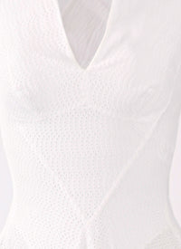 Embroidered dress with crossed back straps - White