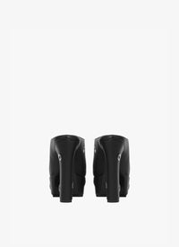 Square-heeled mules with maxi eyelets in leather - Black